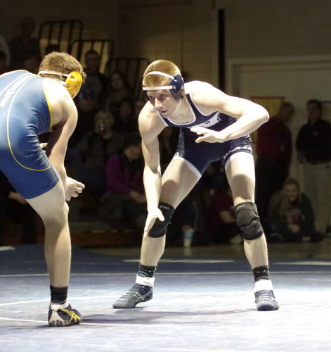 Times Observer photo by Ben Oviatt Warren's Jake Engstrom and Eisenhower's Spencer Head square off in Friday's 152-pound match at WAHS.